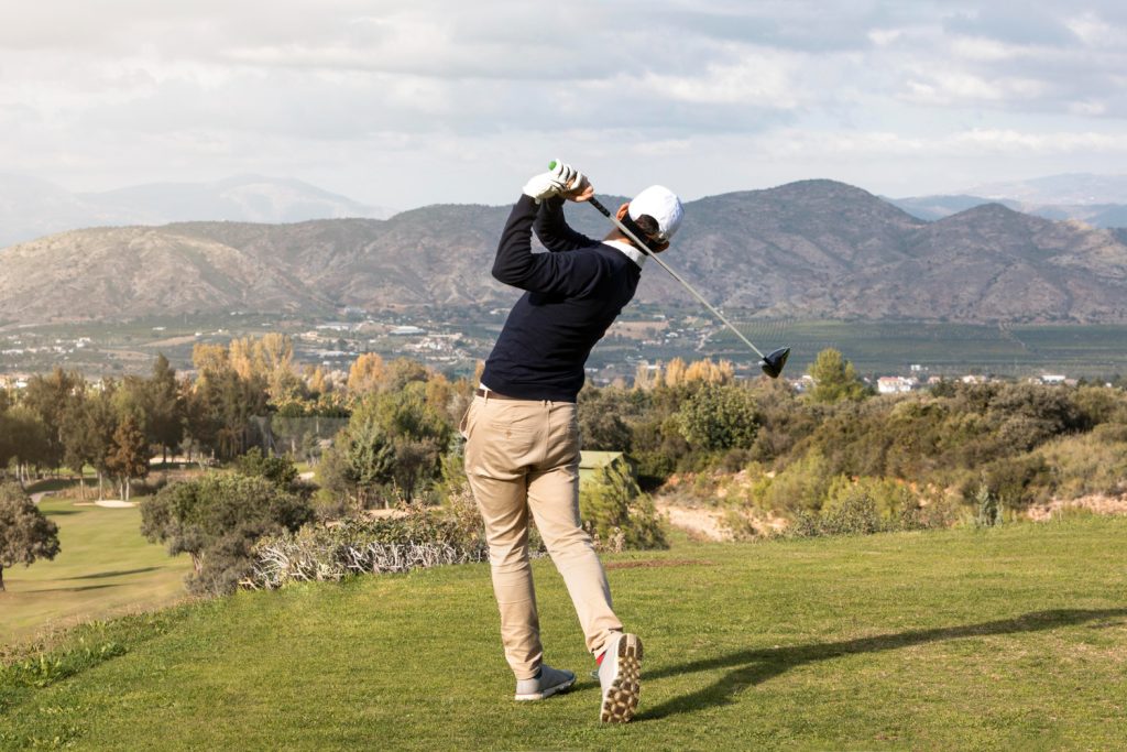 Top 12 All-Inclusive International Golf Holiday Destinations 2 back view man playing golf field